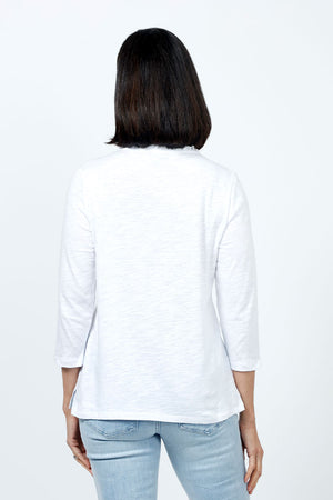 Top Ligne Ruffle Trim Tee in White. Slub cotton v neck 3/4 sleeve tee with ruffle trim at neckline. Relaxed fit._35202202370248