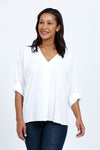 Top Ligne Dolman Roll Tab Top in White.  Gently crinkled fabric.  V neck with center front pleat.  Dolman 3/4 sleeve with roll button tab cuff.  A line shape.  Relaxed fit._t_34767644098760