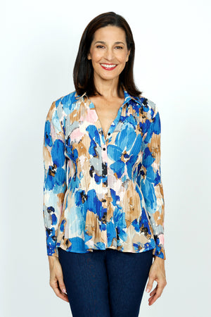 Cali Girls Watercolor Floral Pleated Blouse.  Shades of blue and beige large floral print.  Pointed collar with split v neck button down.  Long pleated sleeves.  Miniature vertical pleats around torso.  Relaxed fit._59451177894254