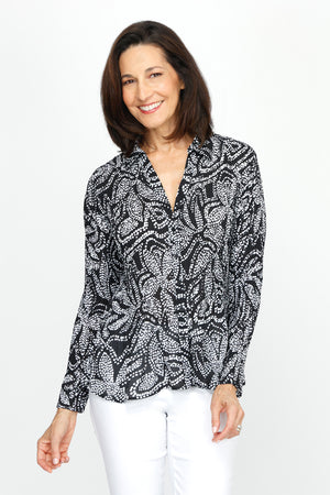 Cali Girls Floral Pleated Blouse in Black/White.  White dotted floral print on black.  Pointed collar notched v button down with long sleeves.  Mini pleats through body and sleeve.  Relaxed fit._60245526806894