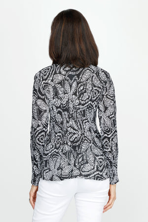Cali Girls Floral Pleated Blouse in Black/White.  White dotted floral print on black.  Pointed collar notched v button down with long sleeves.  Mini pleats through body and sleeve.  Relaxed fit._60245526741358