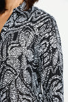 Cali Girls Floral Pleated Blouse in Black/White.  White dotted floral print on black.  Pointed collar notched v button down with long sleeves.  Mini pleats through body and sleeve.  Relaxed fit._t_60245526774126