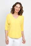 Ten Oh 8 Elbow Sleeve Sweater in Yellow.  V neck dolman 3/4 sleeve horizontal rib knit.  Front center seam.  Braid trim at neck, cuff and curved hem.  Relaxed fit._t_35432838791368