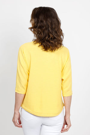 Ten Oh 8 Elbow Sleeve Sweater in Yellow. V neck dolman 3/4 sleeve horizontal rib knit. Front center seam. Braid trim at neck, cuff and curved hem. Relaxed fit._35432838758600