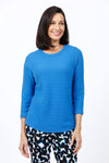 Ten Oh 8 Button Back Sweater in Ocean blue.  Crew neck 3/4 sleeve horizontal textural rib.  Curved hem.  Braid trim at neck, hem and cuff.  Button detail down center back. Relaxed fit._t_34826715136200