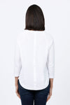 Ten Oh 8 Button Back Sweater in White. Crew neck 3/4 sleeve horizontal textural rib. Curved hem. Braid trim at neck, hem and cuff. Button detail down center back. Relaxed fit._t_34826715103432