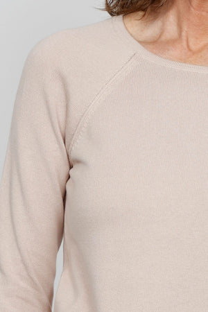 Ten Oh 8 Round Neck Raglan Sweater in Sand. Raglan sleeve round neck knit with 3/4 sleeve. Curved hem. Relaxed fit._35432687993032