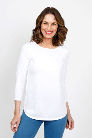 Ten Oh 8 Round Neck Raglan Sweater in White. Raglan sleeve round neck knit with 3/4 sleeve. Curved hem. Relaxed fit._35432688058568