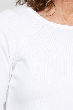 Ten Oh 8 Round Neck Raglan Sweater in White. Raglan sleeve round neck knit with 3/4 sleeve. Curved hem. Relaxed fit._35432687894728