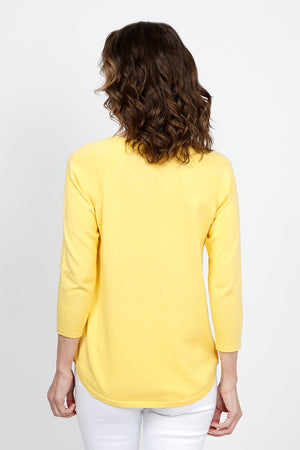 Ten Oh 8 Round Neck Raglan Sweater in Yellow. Raglan sleeve round neck knit with 3/4 sleeve. Curved hem. Relaxed fit._35432687960264