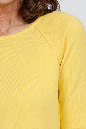 Ten Oh 8 Round Neck Raglan Sweater in Yellow. Raglan sleeve round neck knit with 3/4 sleeve. Curved hem. Relaxed fit._35432688091336