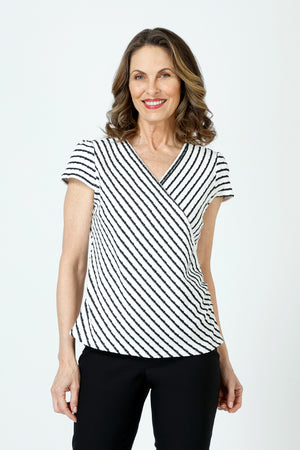 Top Ligne Pucker Stripe Cap Sleeve Surplice Top in Black/White.  Textured stripe v neck with diagonal striped surplice front.  Horizontal stripe back.  Ruch detail at sides.  Cap sleeve.  Relaxed fit._60254389141870