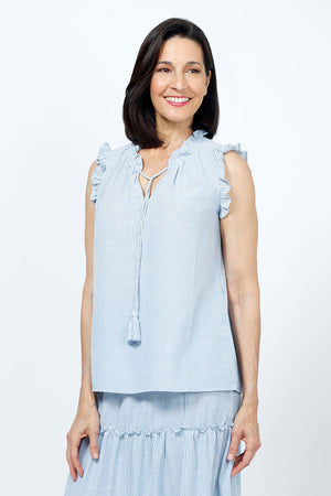 Organic Rags Washable Linen Striped Ruffle Trim Top in Denim and white stripes. V neck with ruffle collar and attached tassel ties. Sleeveless with ruffle trim. A line shape. Side slits. Relaxed fit._35181654474952