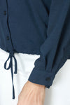 Top Ligne  Pocket Tie Blouse in Indigo.  Pointed collar button down with cinch tie at hem.  Long sleeves with button cuff.  Relaxed fit._t_60711634665838