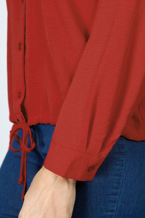 Top Ligne  Pocket Tie Blouse in Paprika.  Pointed collar button down with cinch tie at hem.  Long sleeves with button cuff.  Relaxed fit._60711634567534