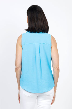 Top Ligne Sleeveless Button Down in Aqua. Lightly textured button down top with pointed collar. Curved hem. Relaxed fit._35333685149896