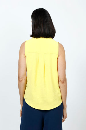 Top Ligne Sleeveless Button Down in Yellow. Lightly textured button down top with pointed collar. Curved hem. Relaxed fit._35202181923016