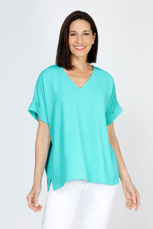 Top Ligne Airflow Dolman V Neck Top in Turquoise.  Lightly textured and airy top.  V neck with short cuffed dolman sleeves.  A line shape.  Relaxed fit._59764799635822