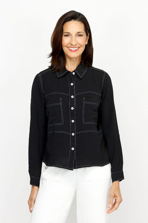 Top Ligne Airflow 2 Pocket Button Front Top in Black.  Pointed collar button down with horizontal stitch detail.  2 front patch pockets with white top stitch detail.  Long sleeves with button cuffs.  Relaxed fit._61184844857710
