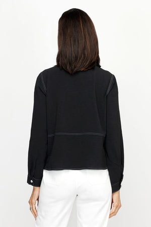 Top Ligne Airflow 2 Pocket Button Front Top in Black.  Pointed collar button down with horizontal stitch detail.  2 front patch pockets with white top stitch detail.  Long sleeves with button cuffs.  Relaxed fit._61184844890478