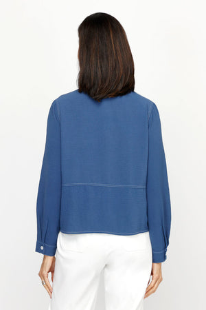 Top Ligne Airflow 2 Pocket Button Front Top in Indigo.  Pointed collar button down with horizontal stitch detail.  2 front patch pockets with white top stitch detail.  Long sleeves with button cuffs.  Relaxed fit._61184844956014