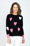 Ten Oh 8 Hearts Crew Sweater in Black.  Intarsia hearts in pink and white.  Contrast cuffs in pink.  Crew neck, long sleeve with dropped shoulders.  Rib trim at neck hem and cuff.  Side slits.  Relaxed fit._t_59519665602926