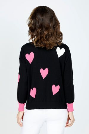 Ten Oh 8 Hearts Crew Sweater in Black.  Intarsia hearts in pink and white.  Contrast cuffs in pink.  Crew neck, long sleeve with dropped shoulders.  Rib trim at neck hem and cuff.  Side slits.  Relaxed fit._59519665537390