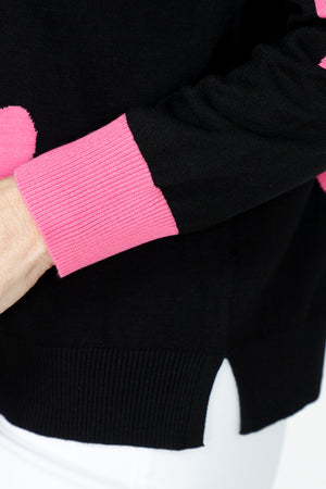 Ten Oh 8 Hearts Crew Sweater in Black.  Intarsia hearts in pink and white.  Contrast cuffs in pink.  Crew neck, long sleeve with dropped shoulders.  Rib trim at neck hem and cuff.  Side slits.  Relaxed fit._59519665406318
