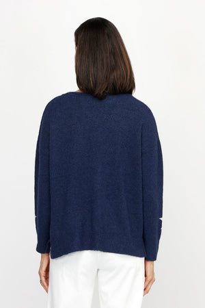 Ten Oh 8 V neck Sweater with Stars in Navy.  Solid and outlines star print on front and sleeves.  Long sleeves.  Rib trim at neck, hem and cuff.  Plain back.  Side slits.  Relaxed fit._61493433598318