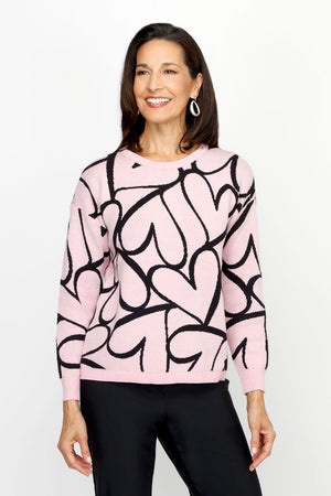 Ten Oh 8 Jacquard Hearts Pullover in Pink with black intarsia overlapping hearts.  Crew neck long sleeve sweater.  Solid rib trim at neck, hem and cuff.  Relaxed fit._61226367353198