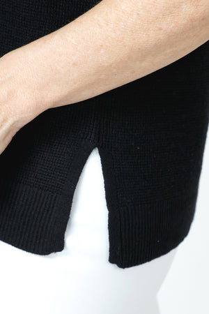 Ten Oh 8 Waffle Short Sleeve V Neck Sweater in Black.  V neck short sleeve waffle weave sweater with dropped shoulder.  Rib trim at neck hem and cuff.  Side slits.  Relaxed fit._59988217692526