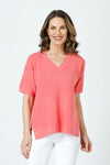 Ten Oh 8 Waffle Short Sleeve V Neck Sweater in Coral.  V neck short sleeve waffle weave sweater with dropped shoulder.  Rib trim at neck hem and cuff.  Side slits.  Relaxed fit._t_59988217561454