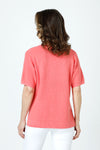 Ten Oh 8 Waffle Short Sleeve V Neck Sweater in Coral.  V neck short sleeve waffle weave sweater with dropped shoulder.  Rib trim at neck hem and cuff.  Side slits.  Relaxed fit._t_59988217463150