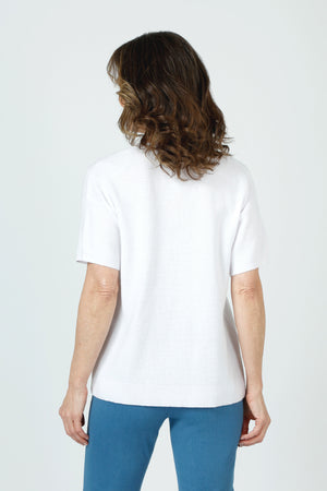 Ten Oh 8 Waffle Short Sleeve V Neck Sweater in White.  V neck short sleeve waffle weave sweater with dropped shoulder.  Rib trim at neck hem and cuff.  Side slits.  Relaxed fit._59988217626990