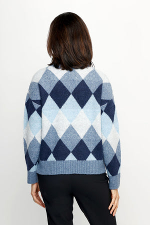 Ten Oh 8 Argyle V Neck Sweater in Blue.  Soft and fuzzy knit in shades of blue white diamonds.  V neck long sleeve sweater with dropped shoulder.  Rib trim at neck hem and cuff.  Relaxed fit._61511935492462