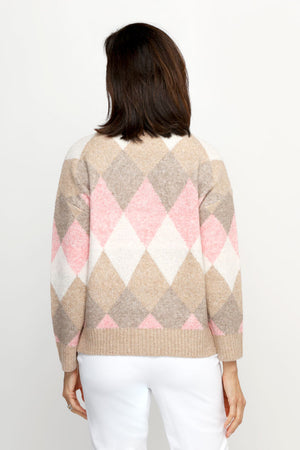 Ten Oh 8 Argyle V Neck Sweater in Tan.  Soft and fuzzy knit in shades of beige, pink and white diamonds.  V neck long sleeve sweater with dropped shoulder.  Rib trim at neck hem and cuff.  Relaxed fit._61511935656302
