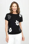 Ten Oh 8 Flowers Bateau Sweater in Black with white intarsia flowers.  Boat neck with dolman short sleeve.  Rib trim at neck, hem and cuff.  Relaxed fit._t_60980063830382