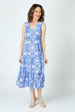 Top Ligne Kaleidoscope Airflow Sleeveless Dress in Blue. Abstract blue multi print on a white background.  Sleeveless v neck dress with faux surplice.  Empire cinchable waist with side ties.  2 tier ruffled skirt.  A line shape. Relaxed fit._59938884551022