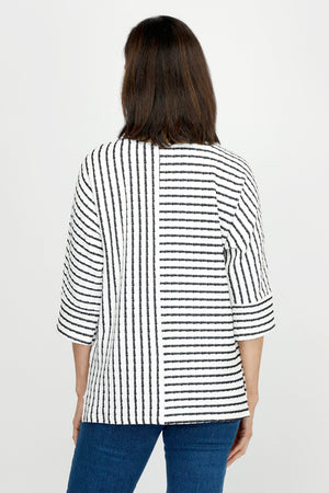 Top Ligne Pucker Mixed Stripe Elbow Sleeve Top in Black/White.  Textural fabric.  Bi directional stripes with center seaming front and back. Crew neck, dolman elbow sleeve with cuff.  High low hem with side slits.  Relaxed fit._60255242092910