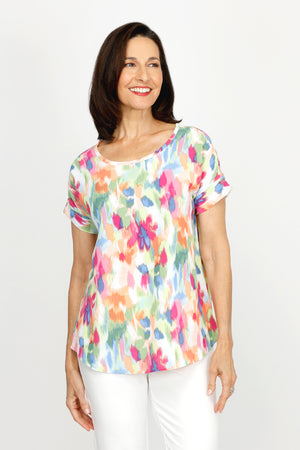 Top Ligne Floral Airflow Round Neck Top in Multi.  Blurred bright multi colored floral print.  Round neck with dolman short sleeve and sewn cuff.  Curved hem.  A line shape.  Relaxed fit._60220240724334