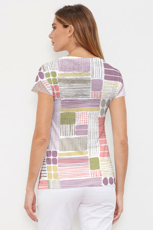 Whimsy Rose Abstract Geo Cap Sleeve Top. Pink, purple, green and gold circle and line print on a white background. High v neck cap sleeve top. Burnout fabric. Sublimation smiles create one of a kind effect. Straight hem. A line shape._34300660383944