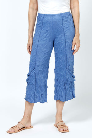 Top Ligne Crinkle Crop with Draped Pocket in Indigo. 2" elastic waist with raised center seams. Wide cropped leg with draped pockets on outer leg. 21" inseam._35194872725704