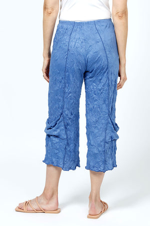 Top Ligne Crinkle Crop with Draped Pocket in Indigo. 2" elastic waist with raised center seams. Wide cropped leg with draped pockets on outer leg. 21" inseam._35194872791240