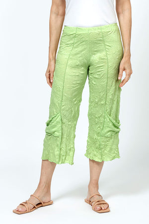 Top Ligne Crinkle Crop with Draped Pocket in Lime. 2" elastic waist with raised center seams. Wide cropped leg with draped pockets on outer leg. 21" inseam._35194872856776