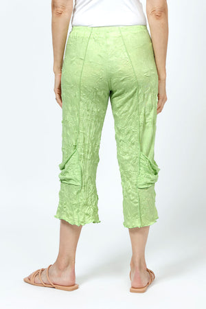 Top Ligne Crinkle Crop with Draped Pocket in Lime. 2" elastic waist with raised center seams. Wide cropped leg with draped pockets on outer leg. 21" inseam._35194872758472