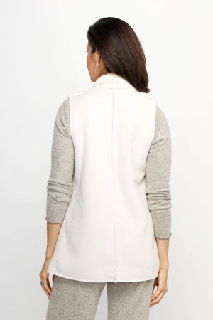 Top Ligne Sherpa Vest in Cream.  Sleeveless faux sheepskin topper.  Large fold back collar.  Open front.  Contour seams.  Front pockets.  Relaxed fit._61517622706542