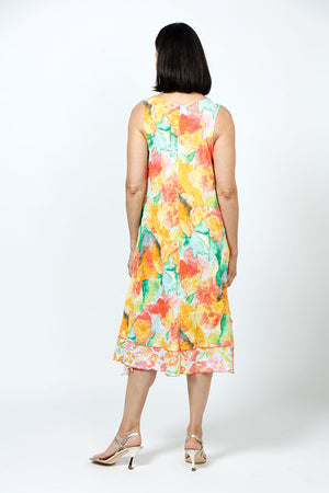 Top Ligne Crinkle Layered Florals Tank Dress in Mango. Orange, green yellow and white abstract large floral print with floral print accents. Scoop neck 3/4 sleeve dress with diagonal front seaming in large floral print. Small floral print inset at hem. Small floral print pocket. A line shape. Relaxed fit._35194787037384