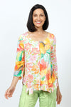 Top Ligne Crinkle Mixed Florals Tee in Mango.  Orange, yellow and green floral prints on a white background.  Scoop neck 3/4 sleeve top with raised center front seam.  2 different floral patterns on front and sleeves.  Asymmetric flounce inset at hem.  Relaxed fit._t_35195838070984