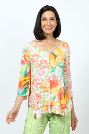 Top Ligne Crinkle Mixed Florals Tee in Mango.  Orange, yellow and green floral prints on a white background.  Scoop neck 3/4 sleeve top with raised center front seam.  2 different floral patterns on front and sleeves.  Asymmetric flounce inset at hem.  Relaxed fit._35195838070984