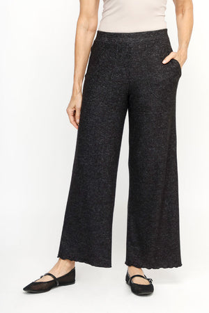 Top Ligne Soft Knit Seamed Pant in Black.  Elastic waist wide leg draped pant.  Deep front pockets.  Solid sewn edging around pocket and hem.  28" inseam._61516733186414